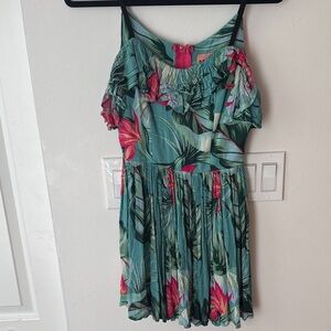 A Classic Paradise Tropical Dress with ruffle top adjustable straps and pockets